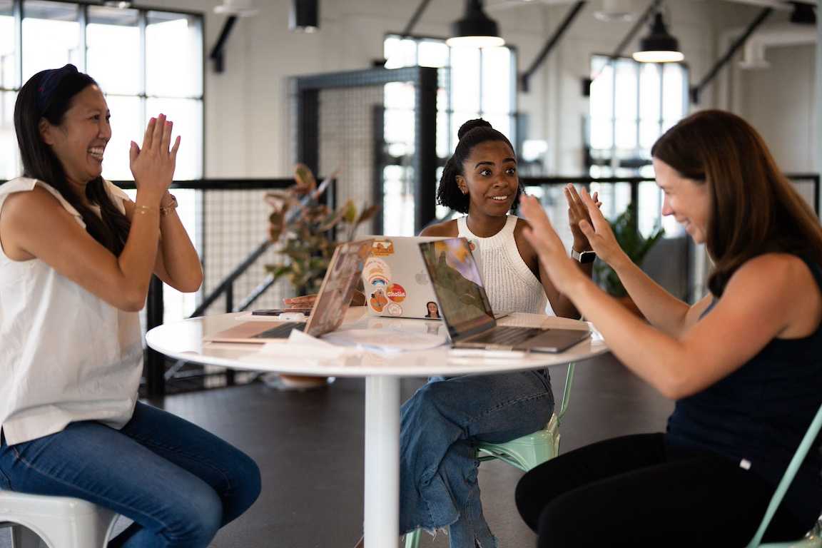 Collaborating around a table in the Culdesac lounge