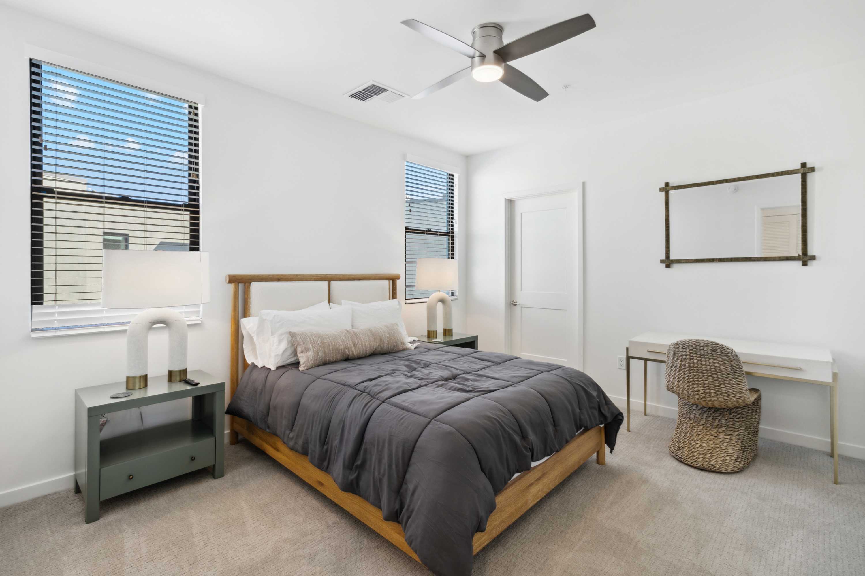 Contemporary bedroom with a large bed, modern decor, and ample natural light